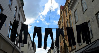 The jeans that are hanging outside.