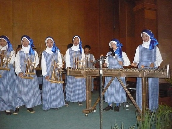 My sister played this angklung, when she went to Bandung city. This instrument played with a bamboo tube, which had been arranged so that, the bamboo out some beat and this instruments are usually played together